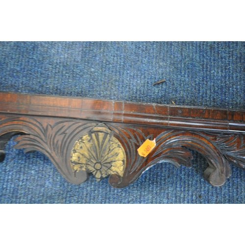 194 - A 19TH CENTURY MAHOGANY BEVELLED EDGE WALL MIRROR, the scrolled and foliate crest with a gilt bird o... 