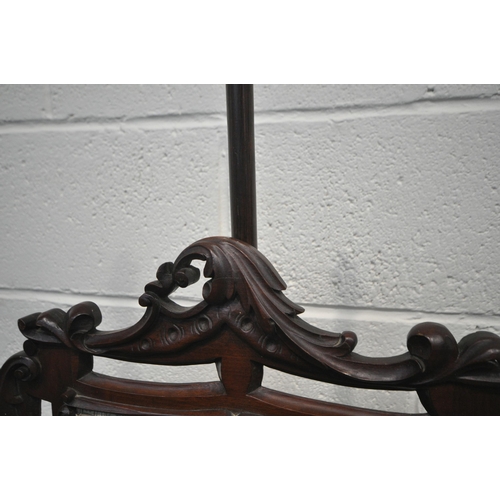 195 - A 19TH CENTURY ROSEWOOD POLE SCREEN, of a fluted form, on a dished base, with three legs, with a lat... 