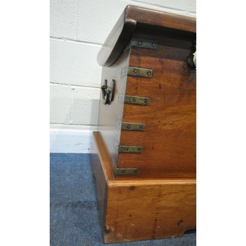 196 - A LATE 20TH CENTURY HARDWOOD BLANKET CHEST, with twin handles, brass banding, the hinged lid enclosi... 