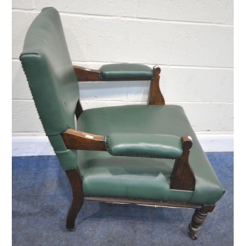 199 - AN EARLY 20TH CENTURY ARMCHAIR, with green leatherette upholstery, raised on turned front legs, widt... 