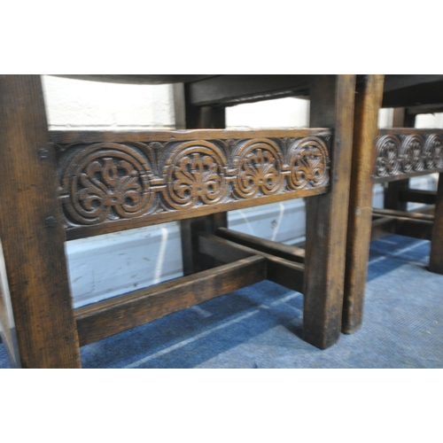 204 - A SET OF FOUR OAK CHAIRS, with brown leather back rest and seat, foliate and scrolled carved details... 