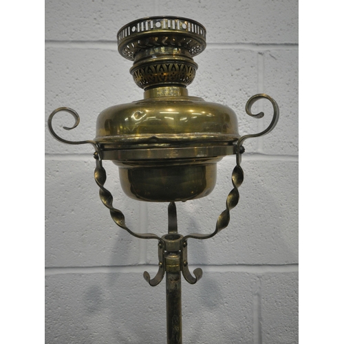 209 - VERITAS LAMP WORKS, A 20TH CENTURY GERMAN BRASS TELESCOPIC OIL LAMP, with spiral supports, raised on... 