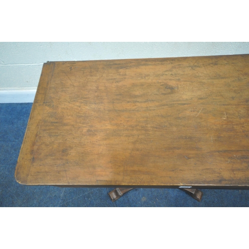 225 - A REGENCY ROSEWOOD TABLE, with a later rotating top, octagonal tapered base, raised on a shaped base... 