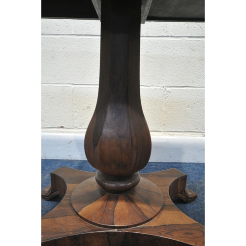 225 - A REGENCY ROSEWOOD TABLE, with a later rotating top, octagonal tapered base, raised on a shaped base... 