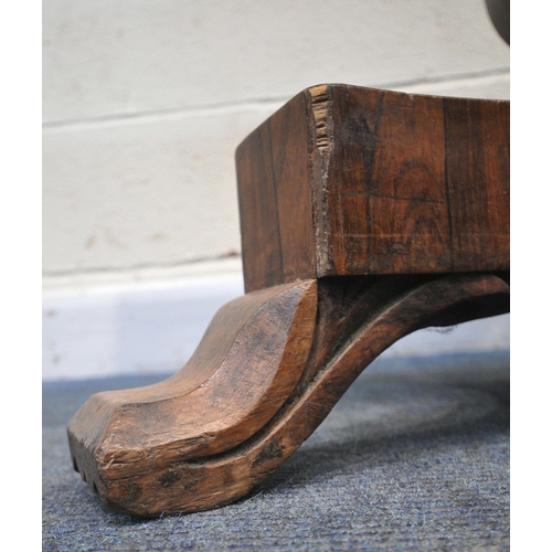 225 - A REGENCY ROSEWOOD TABLE, with a later rotating top, octagonal tapered base, raised on a shaped base... 