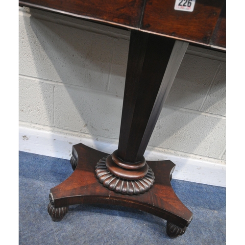 226 - A REGENCY MAHOGANY D END TABLE, raised on an octagonal tapered support, with a shaped base, and acor... 