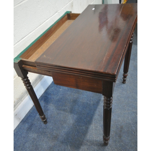 228 - A MAHOGANY FOLD OVER CARD TABLE, the two back legs pull out revealing a storage section, and a table... 