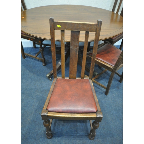 229 - A 20TH CENTURY MAHOGANY OVAL TILT TOP TABLE, raised on a turned support and four legs, width 136cm x... 