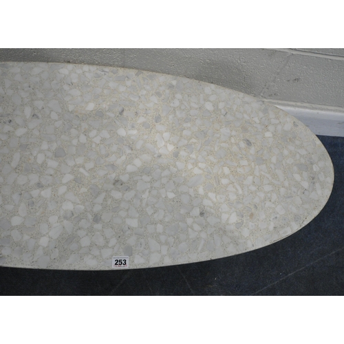 253 - IN THE STYLE OF IGNAZIO GARDELLA, A TERRAZZO OVAL COFFEE TABLE, raised on a tubular metal base, leng... 