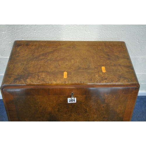 264 - A 20TH CENTURY MAHOGANY AND BURR WALNUT BUREAU, the fall front door enclosing a fitted interior, ove... 