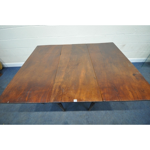 267 - A GEORGIAN MAHOGANY DROP LEAF TABLE, raised on cylindrical turned legs, open width 172cm x closed wi... 