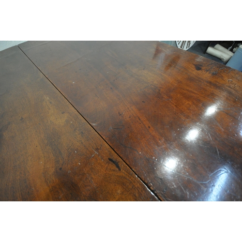 267 - A GEORGIAN MAHOGANY DROP LEAF TABLE, raised on cylindrical turned legs, open width 172cm x closed wi... 