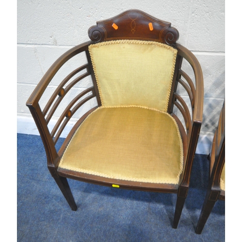 271 - A PAIR OF EDWARDIAN MAHOGANY LADIES AND GENTS ARMCHAIRS, with a scrolled crest, shaped armrests, rai... 