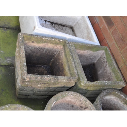 3 - A SELECTION OF LATE 20th CENTURY CONCRETE GARDEN PLANTERS, including a set of four round planters, a... 