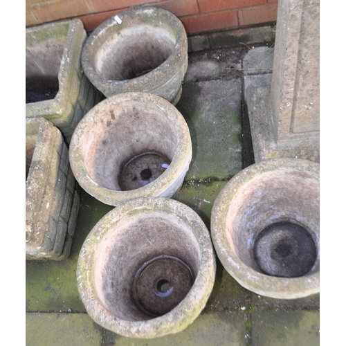 3 - A SELECTION OF LATE 20th CENTURY CONCRETE GARDEN PLANTERS, including a set of four round planters, a... 