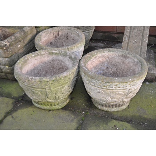 3 - A SELECTION OF LATE 20th CENTURY CONCRETE GARDEN PLANTERS, including a set of four round planters, a... 