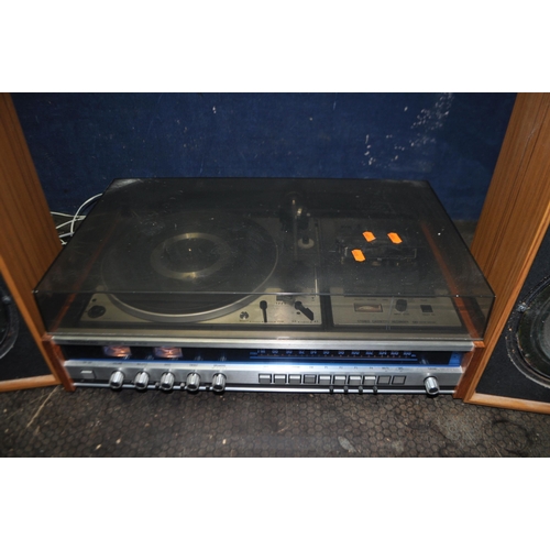 68 - A TANDBERG TR220 VINTAGE MUSIC CENTRE with a teak effect case, smoked plexi glass lid, a Dual 1225 t... 