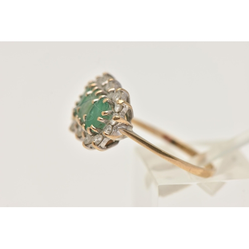 402 - A 9CT GOLD EMERALD CLUSTER RING, designed as three oval cut emeralds each in a claw setting, within ... 