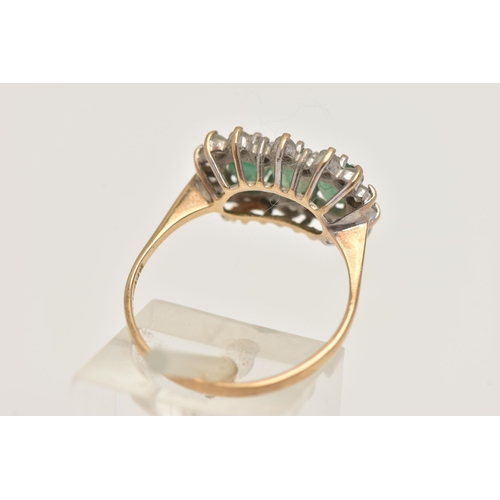 402 - A 9CT GOLD EMERALD CLUSTER RING, designed as three oval cut emeralds each in a claw setting, within ... 