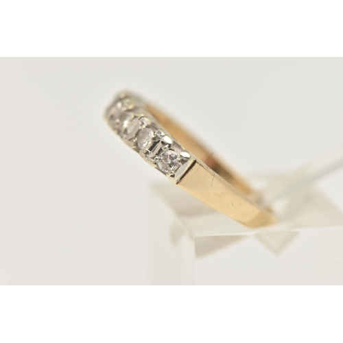 403 - A 9CT GOLD DIAMOND HALF ETERNITY RING, set with a row of seven small round brilliant cut diamonds, e... 