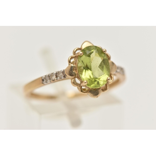 404 - A 9CT GOLD GEM SET RING, set with an oval cut peridot in a four claw scalloped surround, to the sing... 