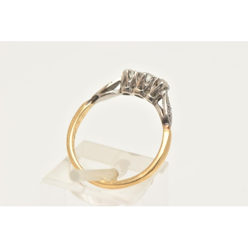 406 - A YELLOW METAL DIAMOND THREE STONE RING, designed as a central round brilliant cut diamond, flanked ... 