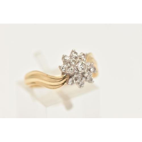 410 - A YELLOW METAL DIAMOND CLUSTER RING, tiered flower cluster of round brilliant cut diamonds, each cla... 