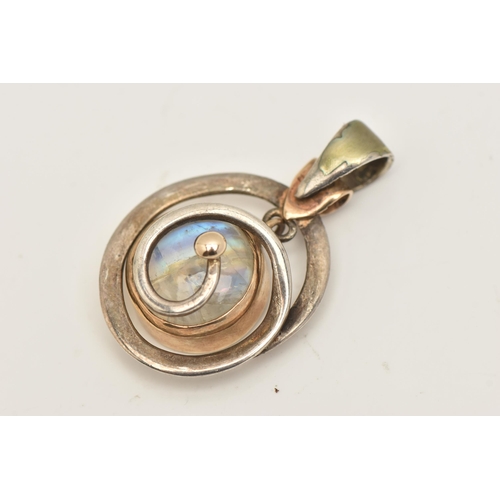 415 - A WHITE  METAL MOONSTONE PENDANT, set with a circular moonstone cabochon, collet set within a yellow... 