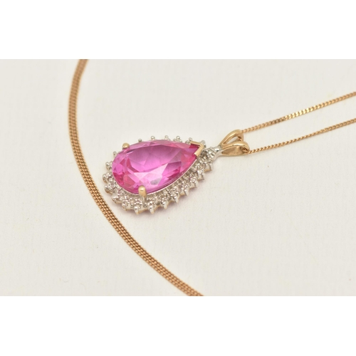 418 - A 9CT GOLD GEM SET PENDANT WITH CHAIN, the pendant of a pear drop shape with a central pear cut pink... 