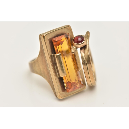 428 - TWO YELLOW METAL RINGS, the first AF set with a rectangular cut orange stone assessed as synthetic s... 