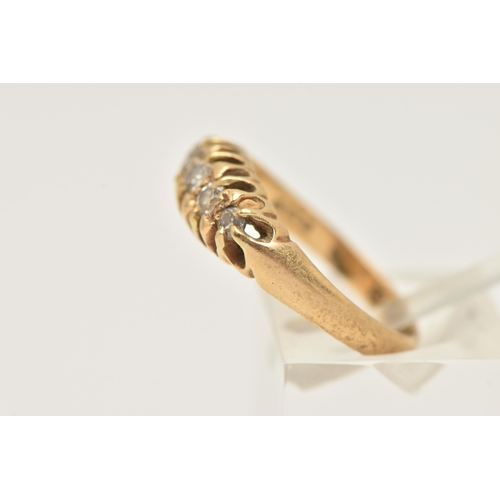 431 - AN EARLY 20TH CENTURY 18CT GOLD DIAMOND BOAT RING, set with a row of five graduating old cut and sin... 