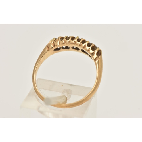 431 - AN EARLY 20TH CENTURY 18CT GOLD DIAMOND BOAT RING, set with a row of five graduating old cut and sin... 