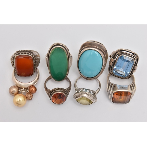 440 - AN ASSORTMENT OF WHITE METAL RINGS, eight white metal gem set dress rings, stones to include topaz, ... 