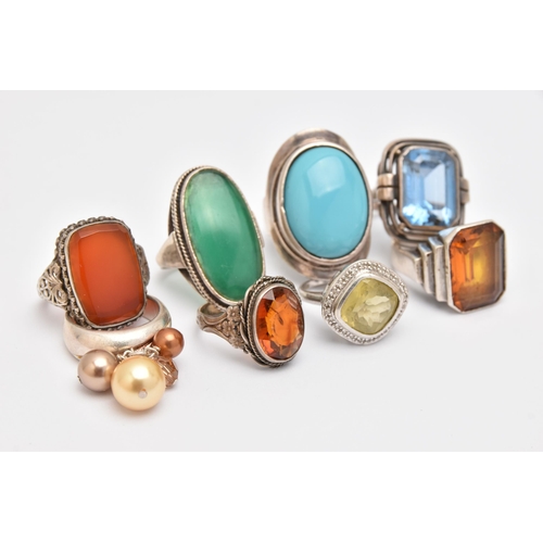 440 - AN ASSORTMENT OF WHITE METAL RINGS, eight white metal gem set dress rings, stones to include topaz, ... 