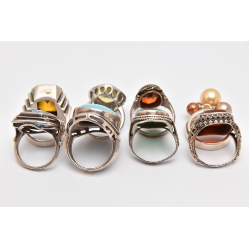 440 - AN ASSORTMENT OF WHITE METAL RINGS, eight white metal gem set dress rings, stones to include topaz, ... 