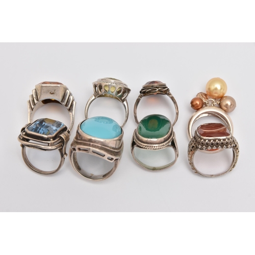 440 - AN ASSORTMENT OF WHITE METAL RINGS, eight white metal gem set dress rings, stones to include topaz, ... 