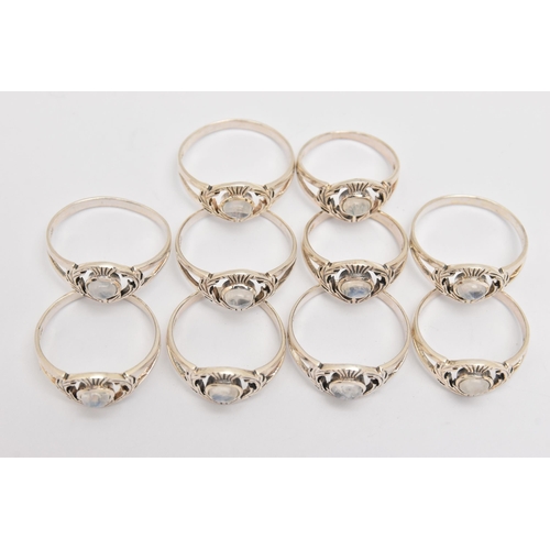 447 - TEN WHITE METAL MOONSTONE THISTLE RINGS, all of the same design, each stamped 925, various ring size... 