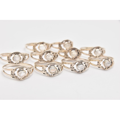 447 - TEN WHITE METAL MOONSTONE THISTLE RINGS, all of the same design, each stamped 925, various ring size... 