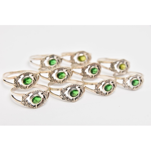 448 - TEN WHITE METAL GEM SET THISTLE RINGS, all of the same design, set with green stones, each stamped 9... 