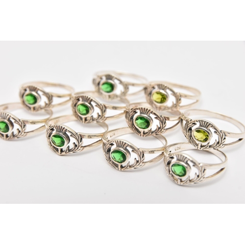 448 - TEN WHITE METAL GEM SET THISTLE RINGS, all of the same design, set with green stones, each stamped 9... 