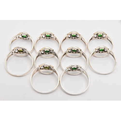 448 - TEN WHITE METAL GEM SET THISTLE RINGS, all of the same design, set with green stones, each stamped 9... 