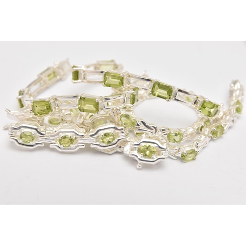 449 - THREE WHITE METAL GEM SET LINE BRACELETS, different designs, all set with peridots, fitted with inte... 