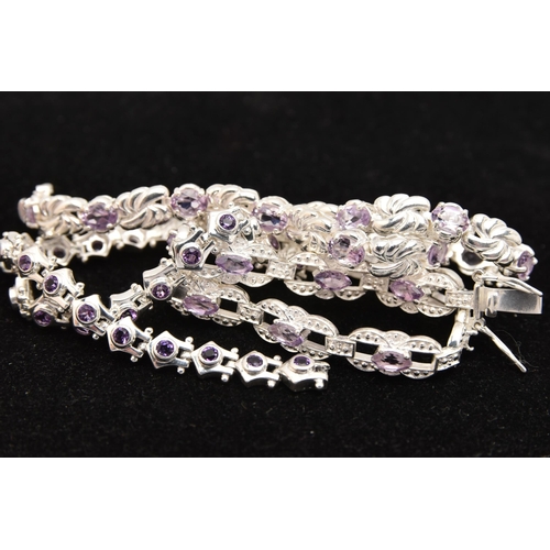 450 - THREE WHITE METAL GEM SET LINE BRACELETS, different designs, all set with amethysts, fitted with int... 