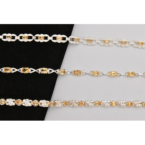 451 - THREE WHITE METAL GEM SET LINE BRACELETS, different designs, all set with Citrine, fitted with integ... 