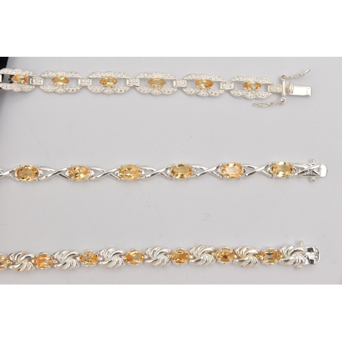 451 - THREE WHITE METAL GEM SET LINE BRACELETS, different designs, all set with Citrine, fitted with integ... 