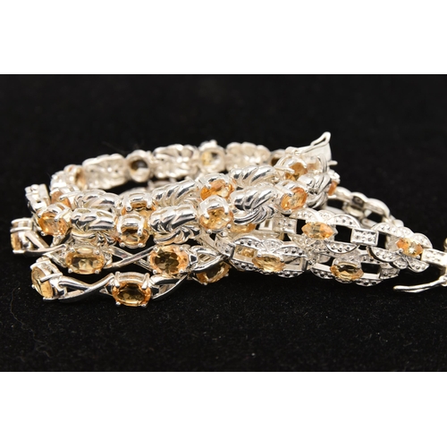 451 - THREE WHITE METAL GEM SET LINE BRACELETS, different designs, all set with Citrine, fitted with integ... 