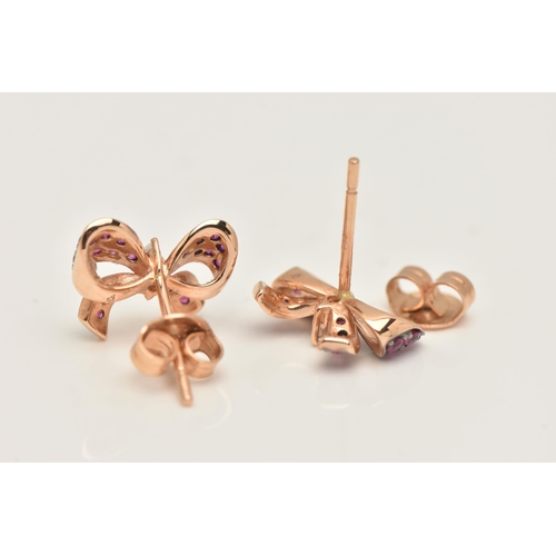 455 - A PAIR OF MODERN GEM SET EARRINGS, a pair of rose metal earrings designed as bows, pave set with cir... 