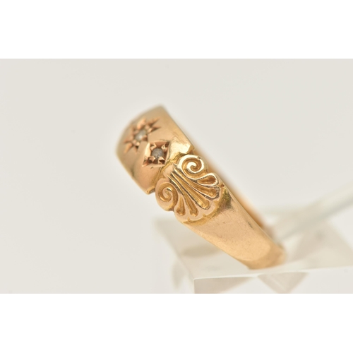 460 - AN 18CT GOLD RING, a yellow gold band ring set with three single cut diamonds and shell detail to th... 