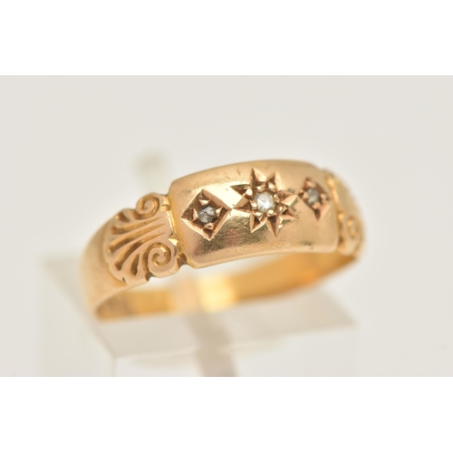 460 - AN 18CT GOLD RING, a yellow gold band ring set with three single cut diamonds and shell detail to th... 