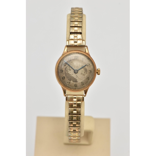 486 - A LADIES 9CT GOLD WRISTWATCH, manual wind watch, round discoloured silver dial signed 'Buren', Arabi... 